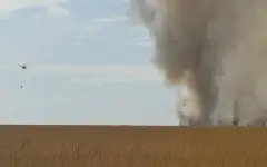 Вертолет и более сотни спасателей тушат горение камыша близ Атырау