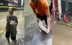 В Китае люди ловят рыбу на затопленных улицах после супертайфуна